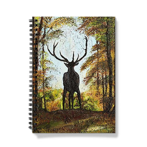 Artistic Journal notebook Proud Stag has the stag in silhouette on the cusp of a hill against his natural habitat of a forest, blue sky behind his head and antlers