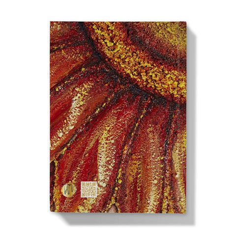 Artistic Hardback Journal Sunflower Passion with the centre of the flower in one corner and the petals reaching out towards the edges of the journal.  Beautiful rich colours of reds & golds