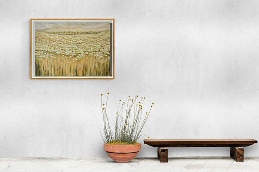 Wall Art Canvas Print Shades Of A Wild Field beautiful soft colours of pale beiges, whites & spontaneous red poppies resting in the calm. Colourful trees in the background and moving clouds in the sky Picture framed on a stone wall with flowers in pot & bench 