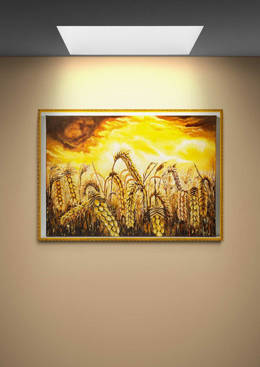 Wall Art Canvas Print Stormy Wheat Field with golden  colours and a sky brewing a  golden dark clouds and white light golden storm  stirring above. Framed in gold on a beige wall with direct sunlight above.