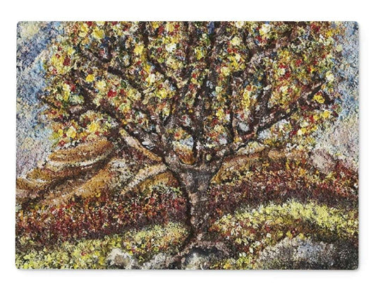 Friendship Tree Glass Chopping Board of a very colourful tree, petals, small fruits on an English moorland Artistic Friendship has a very colourful tree in leaf, & fruits on an with lovely greens & greys for moss & moor rocks on the floor