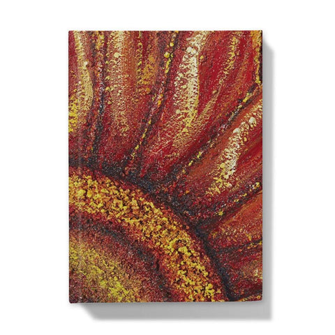 Artistic Hardback Journal Sunflower Passion with the centre of the flower in one corner and the petals reaching out towards the edges of the journal.  Beautiful rich colours of reds & golds