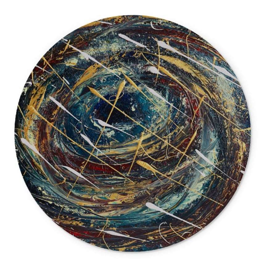 A round beautifully designed Artistic glass cutting board, with abstract design in deep blues, golds, velvet reds, & splashes of whites.