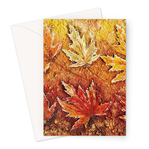 Artistic Blank Greeting Card Autumn Leaves shows a picture of real maple leaves paiinted in golds and Reddy browns, and a very light green also