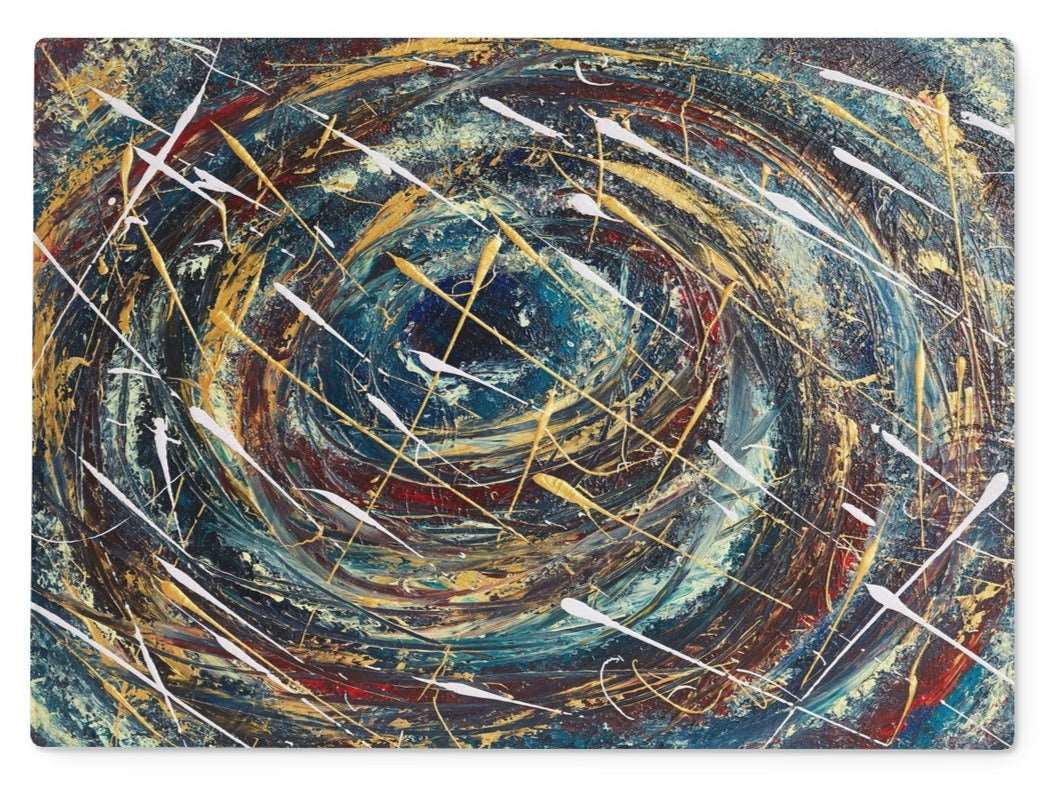 A Rectangular beautifully designed Artistic glass cutting board, with abstract design in deep blues, golds, velvet reds, & splashes of whites.