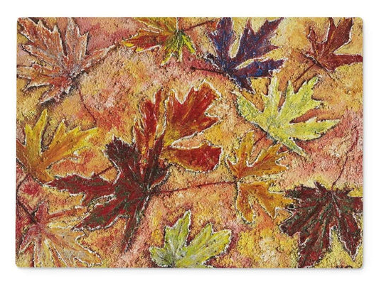 Artistic Glass Cutting Board Tutti Fruitt has all the colours of a rainbow on and around maple leaves as they fell on the ground in a Canadian forest.  Beautiful colours of the fall in Canada