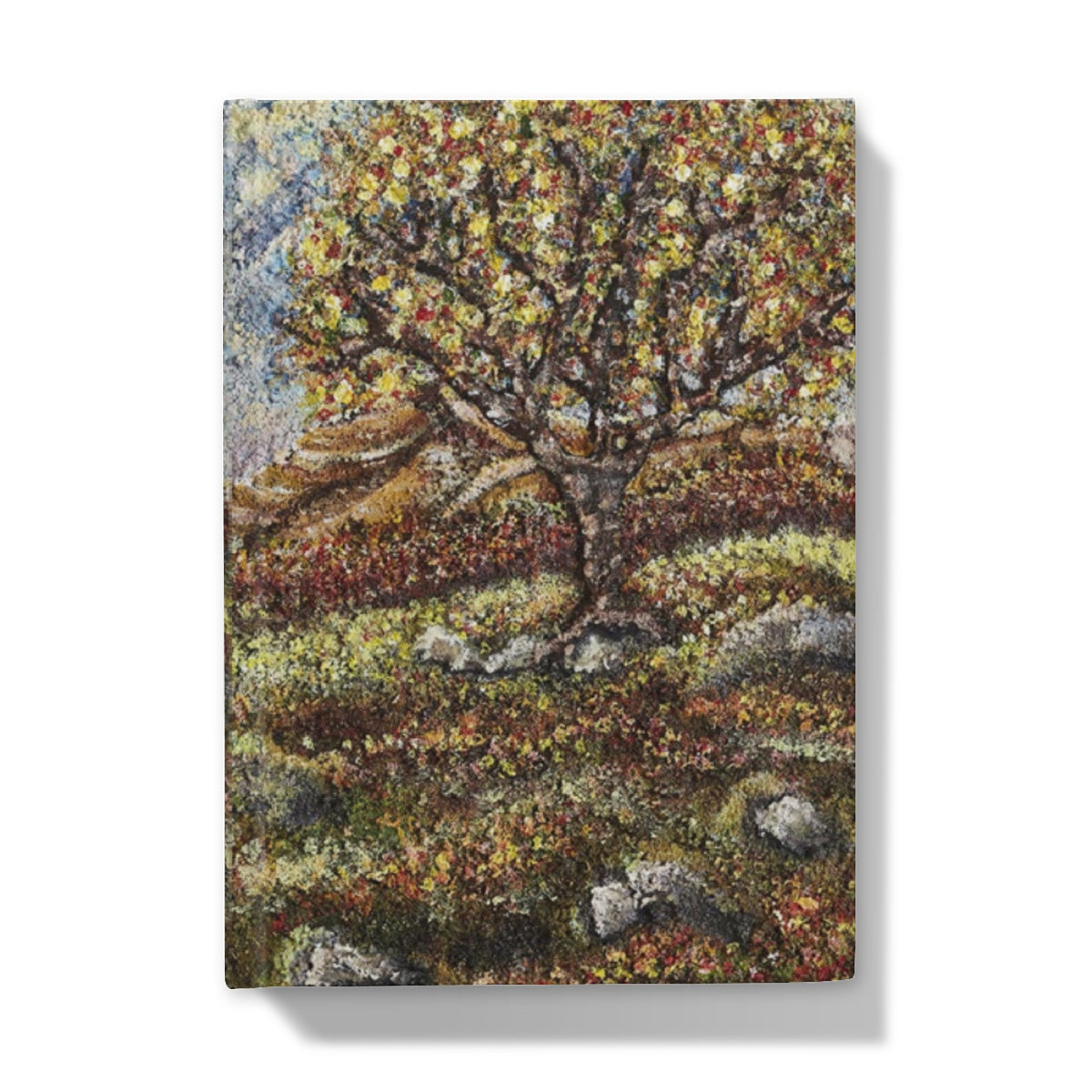 Friendship Tree Hardback Journal  with a beautiful colourful scene of a colourfl tree on an English moorland with hills in the background and rocks closer up with moss and leaves on the floor.