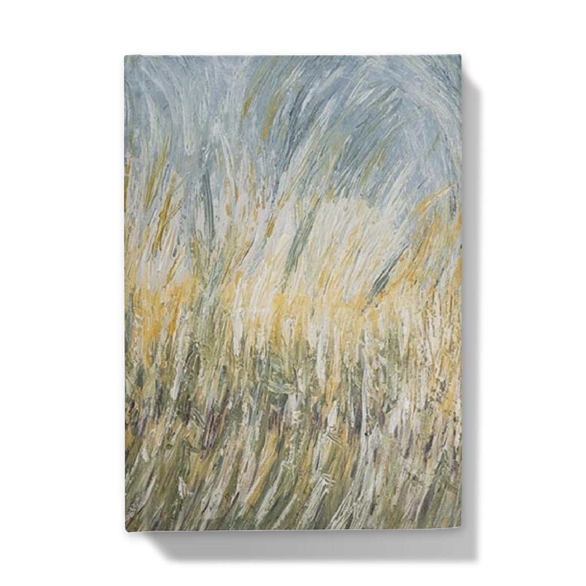 Wheat fields Hardback Journal has an abstract image of wheat swaying in the fields of golds light sage greens & light blues towards the sky.