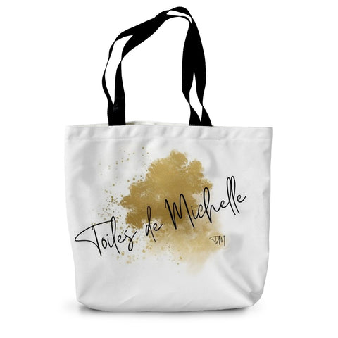 Durable canvas in white with 26" black handles, with a gold & black logo of toiles de michelle