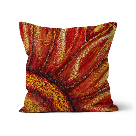 throw pillow with a design of a red sunflower with yellosw & oranges.  Center of flower in one corner with the leaves spreading out .