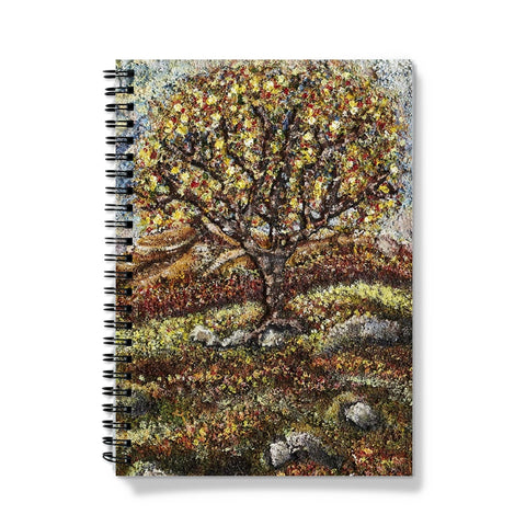 Friendship Tree Notebook, with lots of colours on the leaves of the tree and also on the floor of the moor.  Blue sky and moss & rocks here & there on the ground.  An English tree on the moor in summer