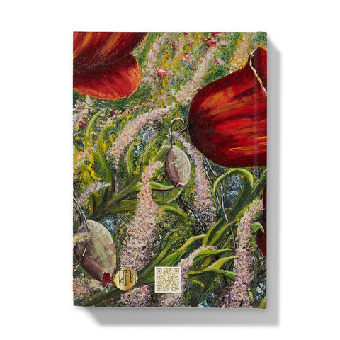 Poppy Love Hardback Journal with bright red poppies in amongst lots of delicate coloured wild flowers of pinks & violets, yellows & oranges all beautifully blowing in the breeze in a field.