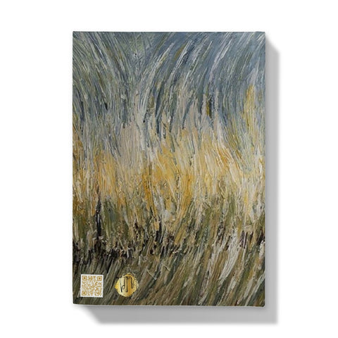 Wheat fields Hardback Journal has an abstract image of wheat swaying in the fields of golds light sage greens & light blues towards the sky.