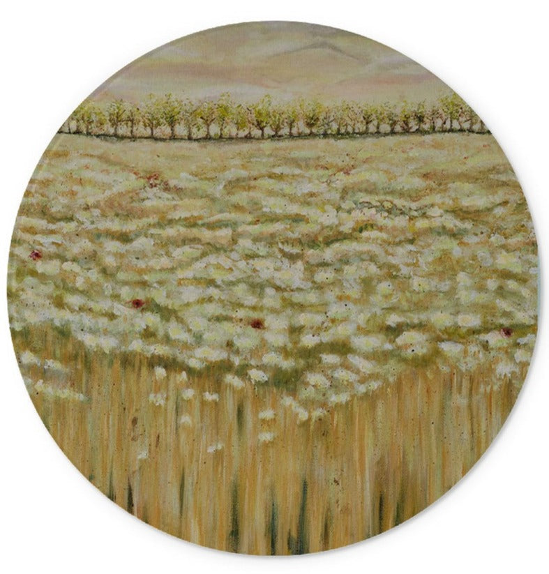 Artistic Glass Cutting Board Shades of a wild field has all the soft colours of beige & creamy white flower dancing in the field with the odd red poppy, trees in the background & a calm sky.