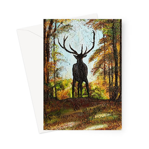 Artistic Proud Stag Blank Greeting Card has the silhouette of a strong proud stag standing firm ion the cusp of a hill in his natural surrounds of an autumnal forest with rich colours around him.