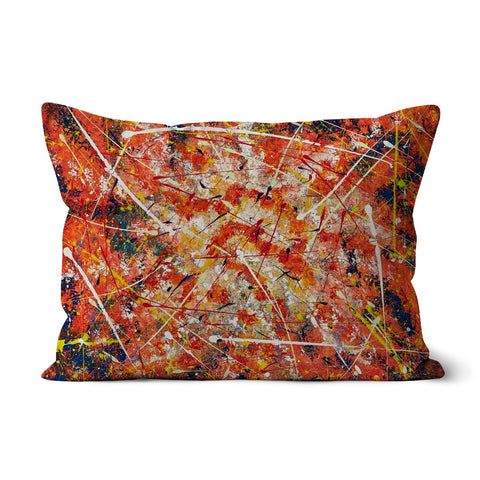 throw pillow with abstract design of splashes of colours in oranges, blues, yellows, whites