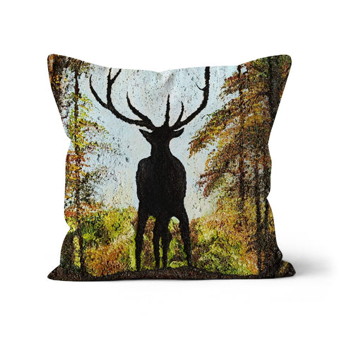 Proud Stag Throw Pillow with Art has the stag in silhouette on the cusp of a hill  against his natural habitat of a forest, blue sky behind his head and antlers