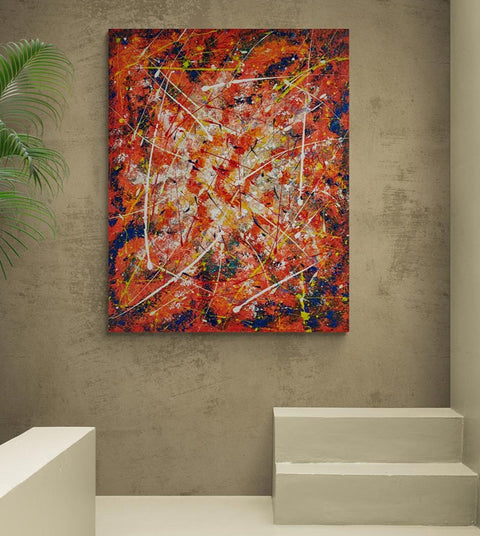 Canvas print wall art 100 x 80 abstract painting strong colours of oranges & blues, with splashes of yellows and slashes of white breaking up the symmetry  A piece full of energy and colour! Mounted onto a large wall with neutral colour