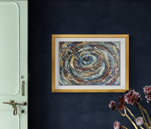 Wall Art Canvas Print Whirlwind or Odyssey x 50 cm canvas of swirling blues,blacks golds, whites & velvety reds. An abstract pieces of work that could be interpenetrated as the eye of a storm, whirlwind, or a part of the universe in space with shooting white stars! hung on a dark blue wall with a gold frame