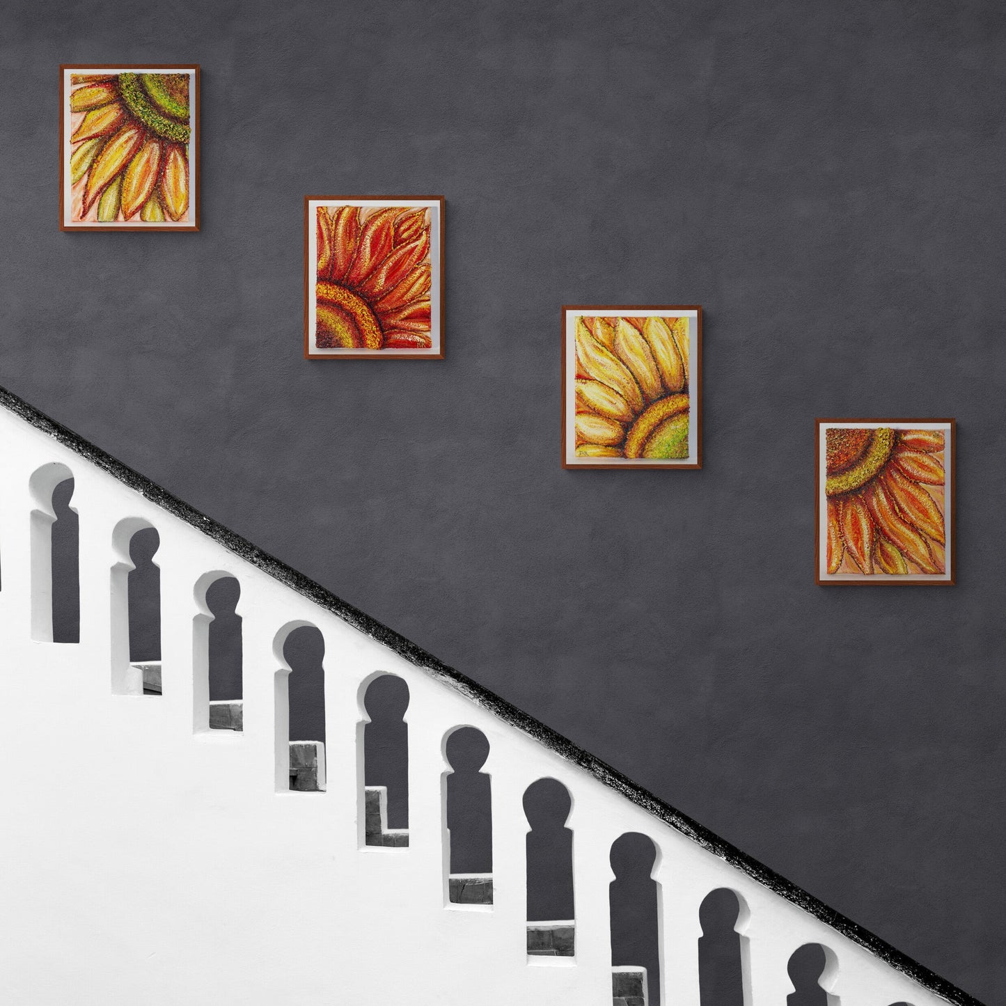 All four original individual sunflower creations  hung on a blue wall hung diagonally on a blue wall and a stone white staircase