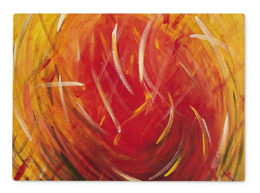 A Rectangular Artistic Glass Cutting Board Warm Energy a red ball of sun & energy surrounded by swirling wind & grass thrown through the air and the yellow hues beyond