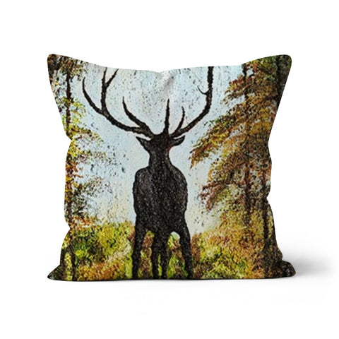 Proud Stag Throw Pillow with Art has the stag in silhouette on the cusp of a hill  against his natural habitat of a forest, blue sky behind his head and antlers