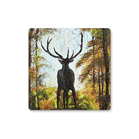 Artistic Proud Stag Coaster has the silhouette of a proud stag standing on the cusp of a terrain surrounded by the colours of an autumn forest of tall trees