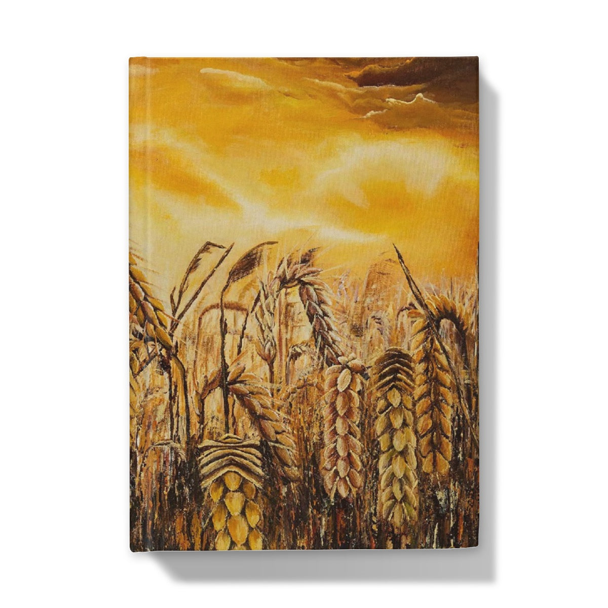 Stormy Wheat Field Hardback Journal with golden colours, auburn caramel heads of wheat & a very brightly light up stormy sky in browns & oranges & white flashes of sunlight