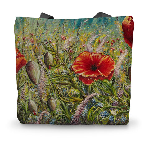 Artistic Poppy Love Canvas Tote Bag with a bright beautiful open red poppy with others in the distance in a field of soft shaded coloured flowers & grasses