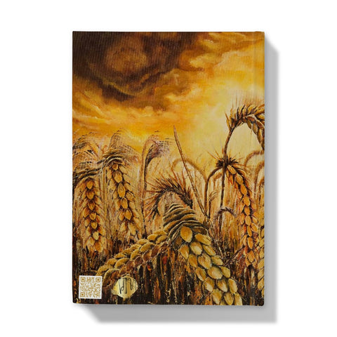 Stormy Wheat Field Hardback Journal with golden colours, auburn caramel heads of wheat & a very brightly light up stormy sky in browns & oranges & white flashes of sunlight