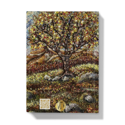 Friendship Tree Hardback Journal  with a beautiful colourful scene of a colourfl tree on an English moorland with hills in the background and rocks closer up with moss and leaves on the floor.