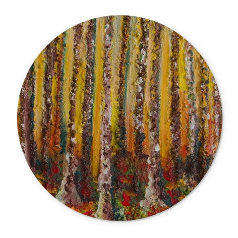 Round Artistic Glass Cutting Board Small Wood with all the colours of autumn, tall tree truncs and coloured bark on the trees. The woods ground is covered in colour from the fallen leaves. Colouring your cooking experience