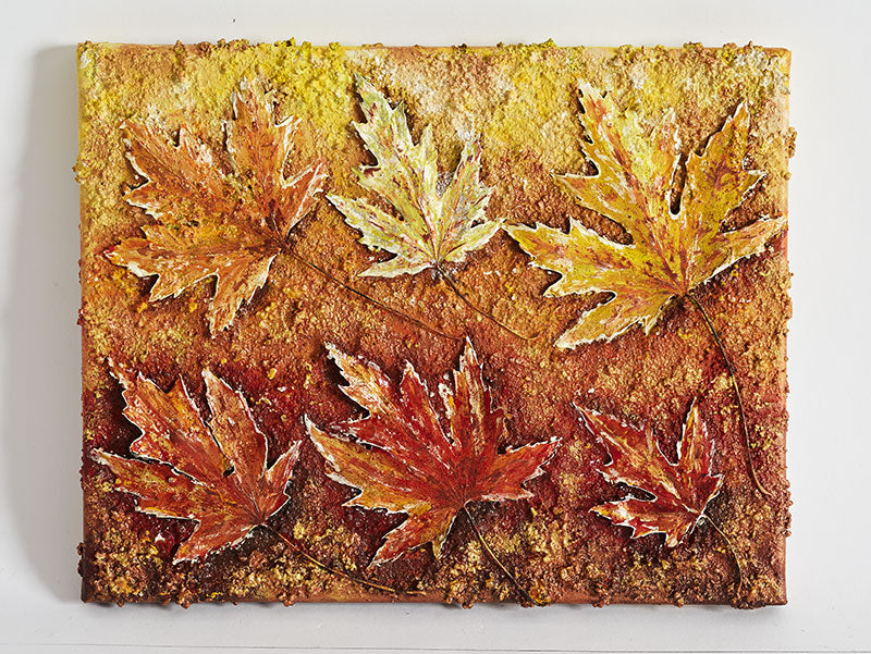 Original Canvas Wall Art Autumn Leaves painting of golden colours of autumn of maple leaves.  Six leaves three above the other three which are golden in colour, underneath caramels & bronzes.  The piece has lots of texture as this piece was made of sand and real leaves