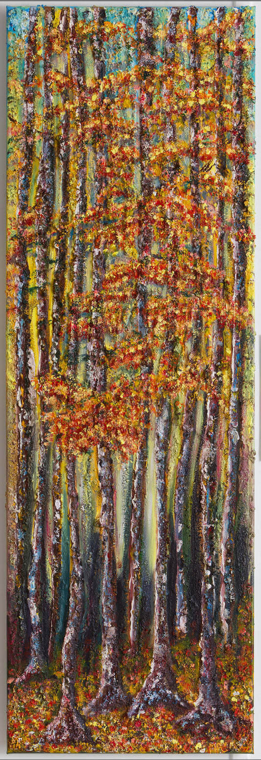 Wall Art canvas 120 x 40 cm of a  forest scene deep within the forest.  Very tall trees  with  strong trunks painted with hues of mauve's and blues in the light behind them also, leading to lighter shades as the light changes towards the sky, of pale blue & hints of clouds.   The leave are a mix of autumnal colours, golds, reds and bronzes, as is the floor of the forest, where the floor is carpeted with fallen leaves of autumn