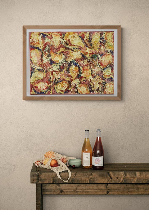 Canvas print wall art Fruits de Mer, An abstract painting of mixed colours & swirling patterns.  Colours of sea foods, of winkles & muscles etc.  Larger swirling patterns of creams beige and golds as found in oysters.  One could call it a dish of paella! .  Picture is framed in a black wooden frame, on a pale beige wall in a kitchen