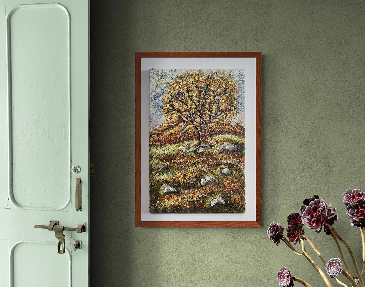 Canvas print wall art friendship tree A painting of a colourfull tree on an english moorland. Colours of summer fields in the background and stone walls, a few granite stones on the ground. The moss has tiny colourfull flowers also of yellows whites reds and creams. Blue sky in the distance with a few cloudsframed in a wooden frame & hung in a dinning room with sage coloured walls